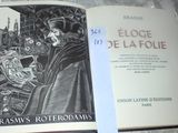 someone is holding a book with a drawing of a man in a black robe