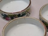 three bowls of milk sitting on a table next to each other