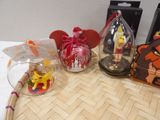 disney figurines are sitting on a table next to a box of candy