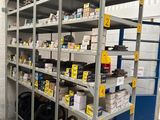 many shelves with tires on them in a warehouse