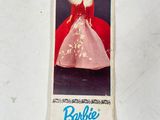 a picture of a barbie doll that is on a table