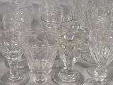 a lot of empty wine glasses sitting on a table