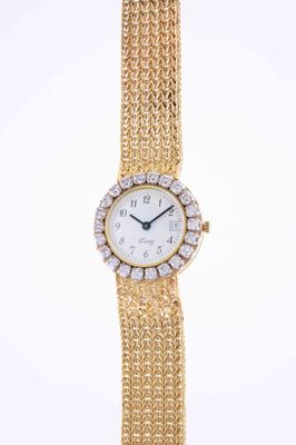 a lady ' s gold and diamond wrist watch