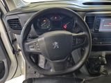 the interior of a car with a steering wheel and dashboard controls