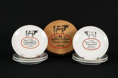 three plates with different designs on them on a black background