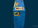 a blue box with a picture of a man and a dog on it