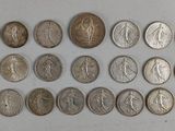 a close up of a bunch of coins sitting on top of a table