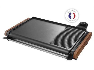a close up of a grill on a white background with a french flag in the background