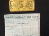 an image of a piece of gold sitting on top of a piece of paper