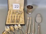 a box with silverware on a table with a number of spoons