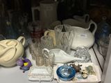 a lot of glass items on the counter in the kitchen