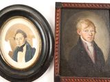 two framed pictures of a man and a woman on the wall