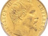 gros plan d'une pièce d'or portant un visage de femme