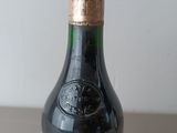 a bottle of wine that is sitting on a table
