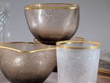 three bowls and two cups sitting on a table