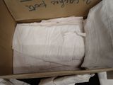 a cardboard box with a lot of pillows inside of it