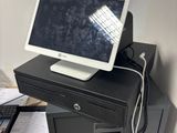 a desktop computer sitting on top of a filing cabinet