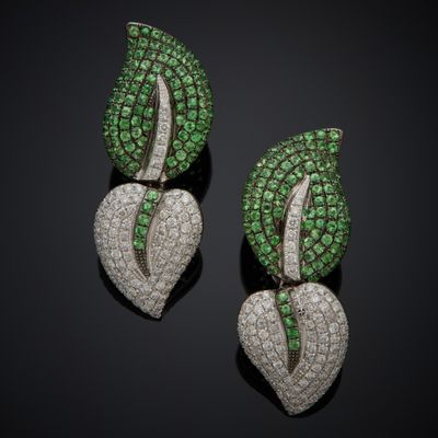a pair of emerald and diamond earrings