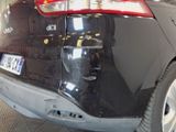 a picture of a car that is being repaired in a garage