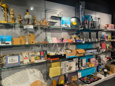 many shelves with various items on them in a store