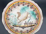 a picture of a decorative plate with a bird on it