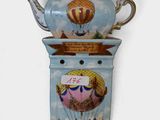 two teapots that are sitting on top of each other