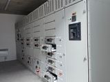 a room with a bunch of electrical equipment in it