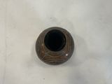 a small vase that is sitting on a table