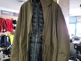 a coat hanging on a rack in a clothing store