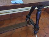 a wooden table with a sign on it in a room