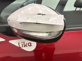 a car mirror with a sticker on the side of it