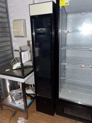 an image of a refrigerator and a table in a room
