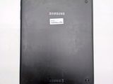 a picture of a black tablet with a sticker on it