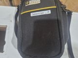 a small black bag with a yellow stripe on it