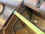 a measuring tape on the side of an old machine