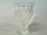a clear glass vase with a spiral design on it