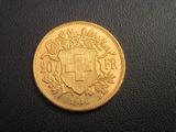 l'image d'une pièce d'or sur laquelle figurent des armoiries