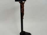 a wooden crucifix with a cross on top of it