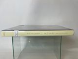 an image of a book sitting on top of a glass table