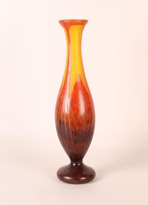 a vase that is sitting on a white surface