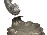an image of a sculpture of a fish on a leaf