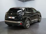 the rear end of a black suv parked in a garage