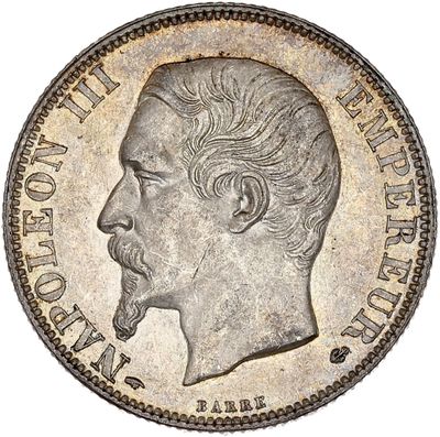 a silver coin with a man ' s face on it