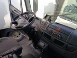 a truck driver ' s dashboard and steering wheel in this picture