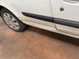 a white car with a black stripe parked in a garage
