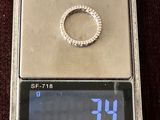 a silver scale with a ring on top of it