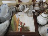 a table with a lot of dishes and cups on it