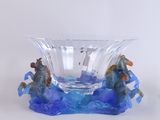 a glass bowl with a horse and a boat inside of it