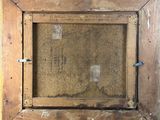 an old picture of a wooden frame with a picture in it