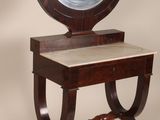 a small table with a mirror on top of it